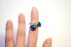 azurite teal stone set rings on fingers