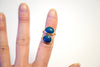 azurite teal stone set rings on finger