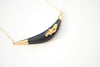 Black necklace, carved with gold