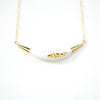 white and gold arc necklace