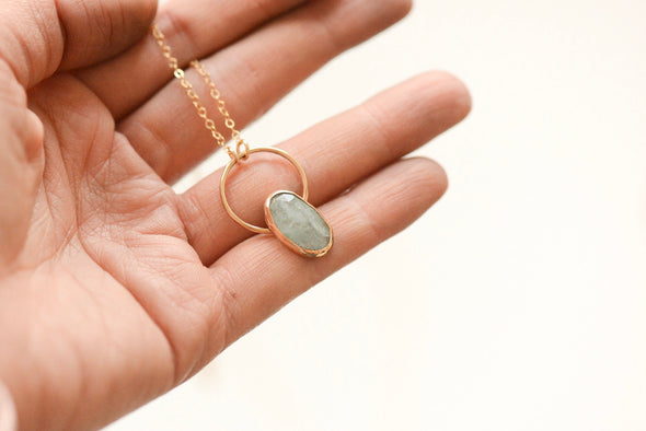 Aquamarine Necklace held in hand