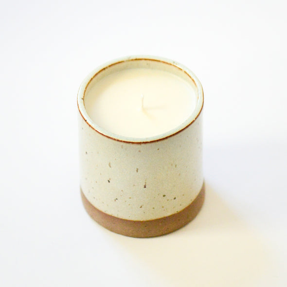 candle poured into ceramic vessel